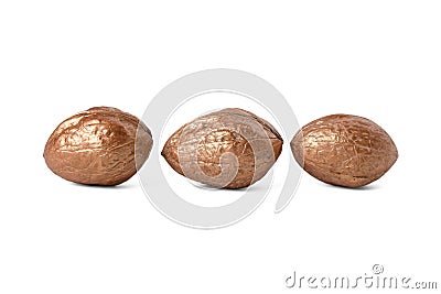 Three golden nuts on white isolated background Stock Photo