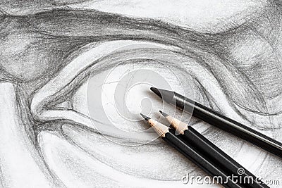 three graphite pencils on drawing of David's eye Stock Photo
