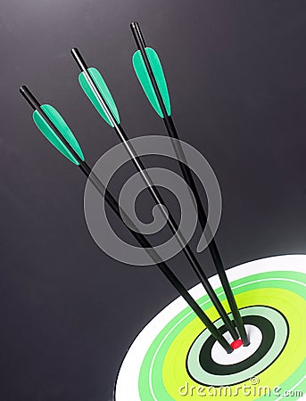 Three Green Black Archery Arrows Hit Round Target Bullseye Center Stock Photo