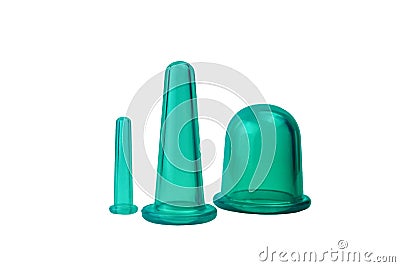 Three green silicone vacuum massage jars of different sizes on a white background. Anti-cellulite silicone vacuum body jars. Home Stock Photo