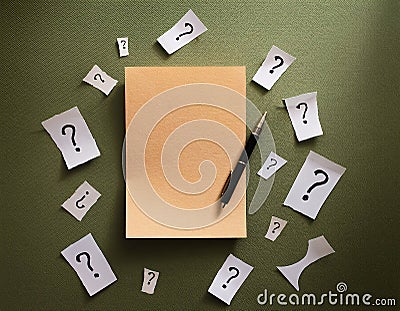 Paper notes with question marks on Khaki background, flat lay. Space for text Stock Photo
