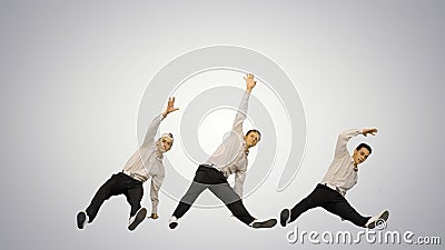 Three guys doing break dance in synch looking at camera on gradi Stock Photo