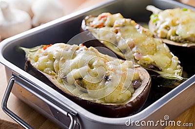 Baked gratin aubergines stuffed with vegetables and mushrooms Stock Photo