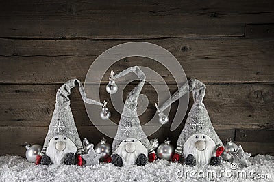 Three handmade gimps on wooden background for christmas decorati Stock Photo