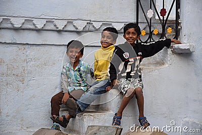 Three happy indian kids smiling at the camera in Udaipur, Rajasthan, India Editorial Stock Photo
