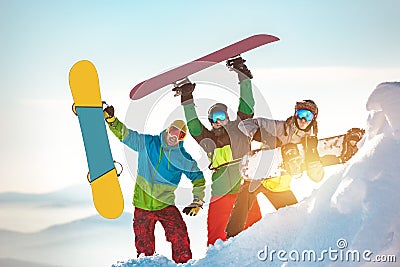 Three happy snowboarders having fun Stock Photo