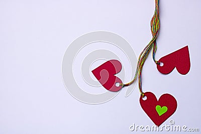 Three hearts linked colorful strings - on white background,copy space Stock Photo