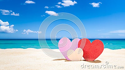 Three hearts on the summer beach - Family Vacation concept Stock Photo