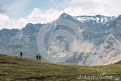 Three hikers on slope Stock Photo