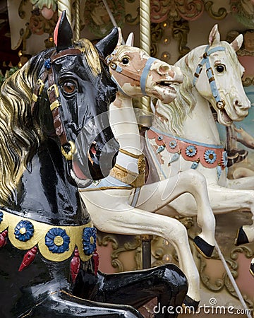 Three horses on fairground carousel Stock Photo