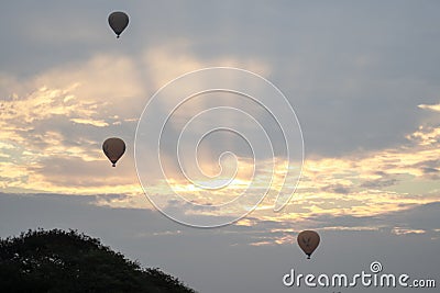 Three hot air balloons in the sky during sunrise in Bagan, Nyaung-U, Myanmar Editorial Stock Photo