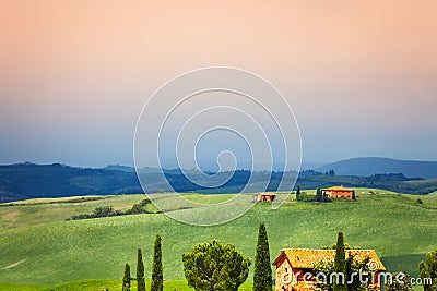 Three houses in Tuscany landscape, Italy Stock Photo