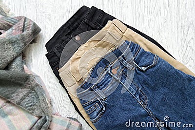 Three jeans, assortment. Blue, beige and black. Fashionable concept Stock Photo