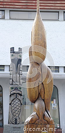 Three Killer Whales With Seal - Carver: David Marston 1989. Cowichan Valley, Vancouver Island, British Columbia, Canada Editorial Stock Photo