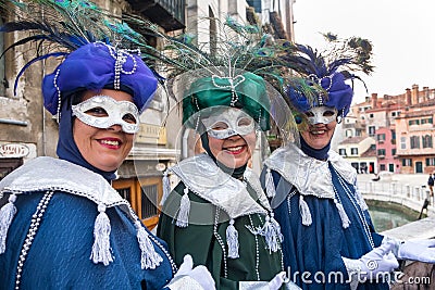 Three ladies wearing costumes for carnival Editorial Stock Photo