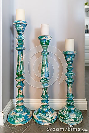 Three large wooden painted retro candlesticks Stock Photo