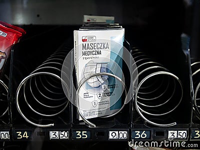 Three layer protective medical face mask package box item inside a vending machine, front view, detail, object closeup Editorial Stock Photo