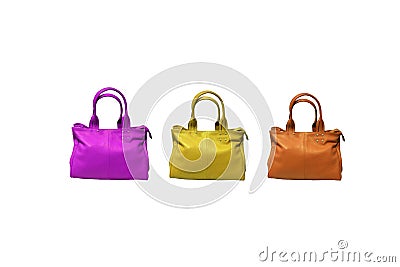 Three leather bags in unique, eye-catching colors isolated on a white background. Stock Photo