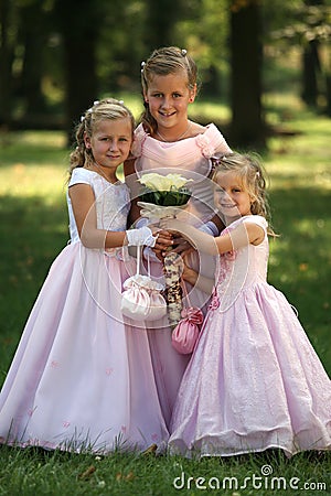 Three little cute bridesmaids Stock Photo