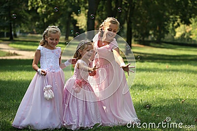 Three little cute bridesmaids with bubble Stock Photo