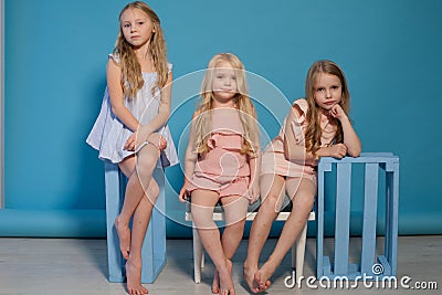 Three little girls girlfriend sit together portrait Stock Photo