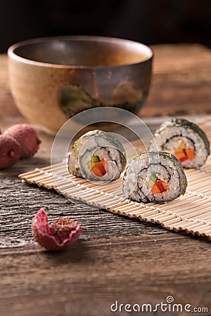 Three delicious vegan sushi rolls, vertical Stock Photo