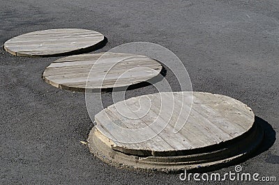 Three Manhole Covers Stock Photo