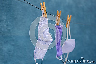 Three masks on the clothesline. Stock Photo