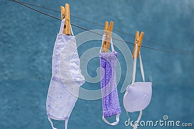 Three masks on the clothesline. Stock Photo