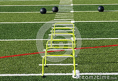 Three medicine balls with six mini hurdles Stock Photo