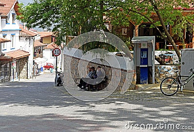 Three elderly Men sitting on a bench in a old Turkish Village Editorial Stock Photo