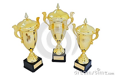 Three metal award cups of different height of gold color Stock Photo