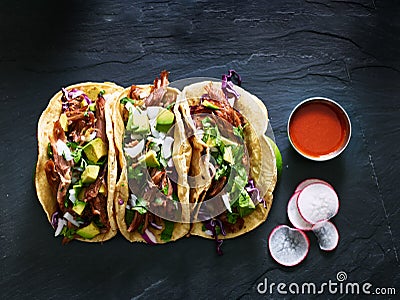 Three mexican pork carnitas tacos flat lay composition Stock Photo