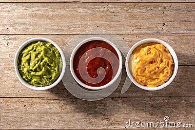 Three Mexican sauces on wooden table Stock Photo