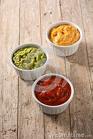 Three Mexican sauces on wooden table Stock Photo