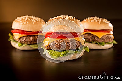 Three mini burgers in a dark ambient Stock Photo