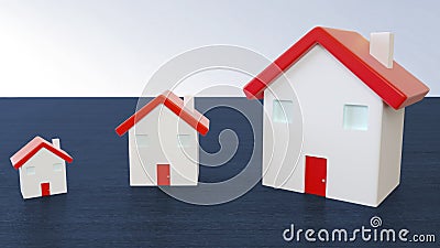 Three miniature houses with red roof on wooden blue background Stock Photo