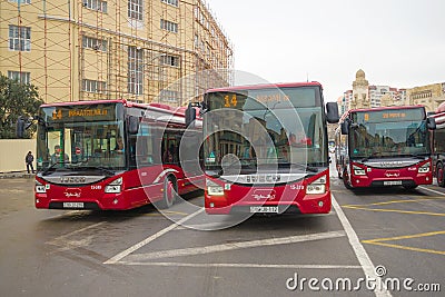 Three modern city buses Iveco at a bus stop, Baku Editorial Stock Photo