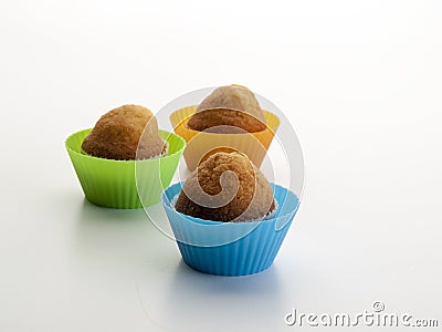 Three muffins baked in their respective molds front view Stock Photo