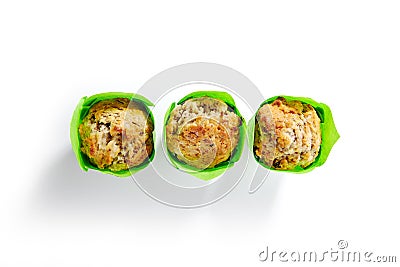 Three Muffins or Cupcakes in Green Paper Isolated Stock Photo