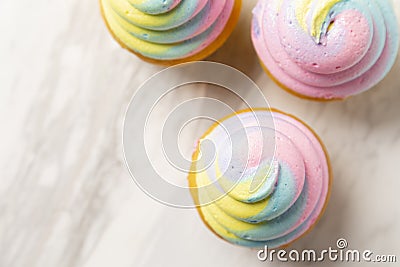 Three Multi Colored Cupcakes Stock Photo