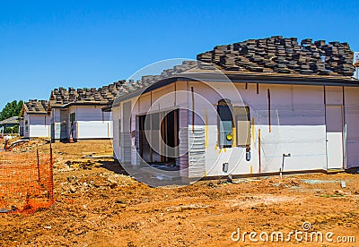 Three New Homes Under Construction Stock Photo