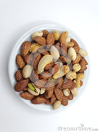 three nuts on top of the bowl,almonds,pistachio and cashew Stock Photo