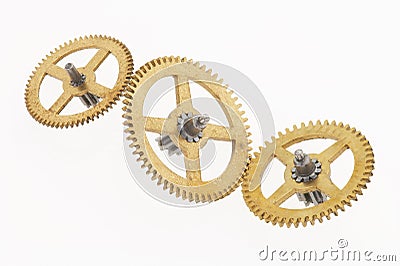 Three old golden cogwheels Stock Photo