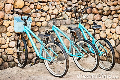 Three old, rusty blue bicycles Stock Photo