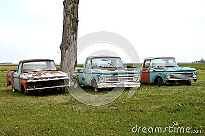 Three old rusty pickups Stock Photo