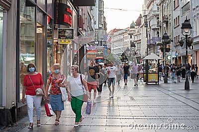 Three old Women, white caucasian females, walking wearing face mask respiration protective equipement on Coronavirus Covid 19 Editorial Stock Photo