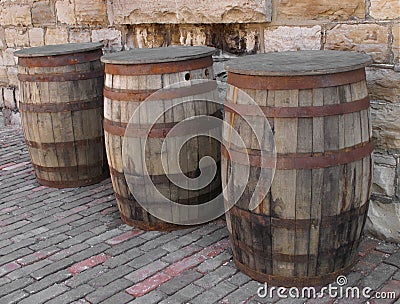 Three old wooden barrels. Stock Photo