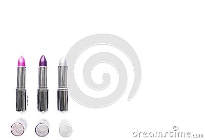 Three open silver metallic tubes of lipstick pink purple and silver isolated on white background. party makeup and fashion concept Stock Photo