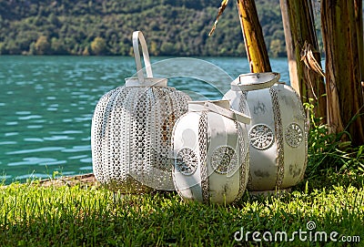 Three oriental white rustic lanterns. Stock Photo